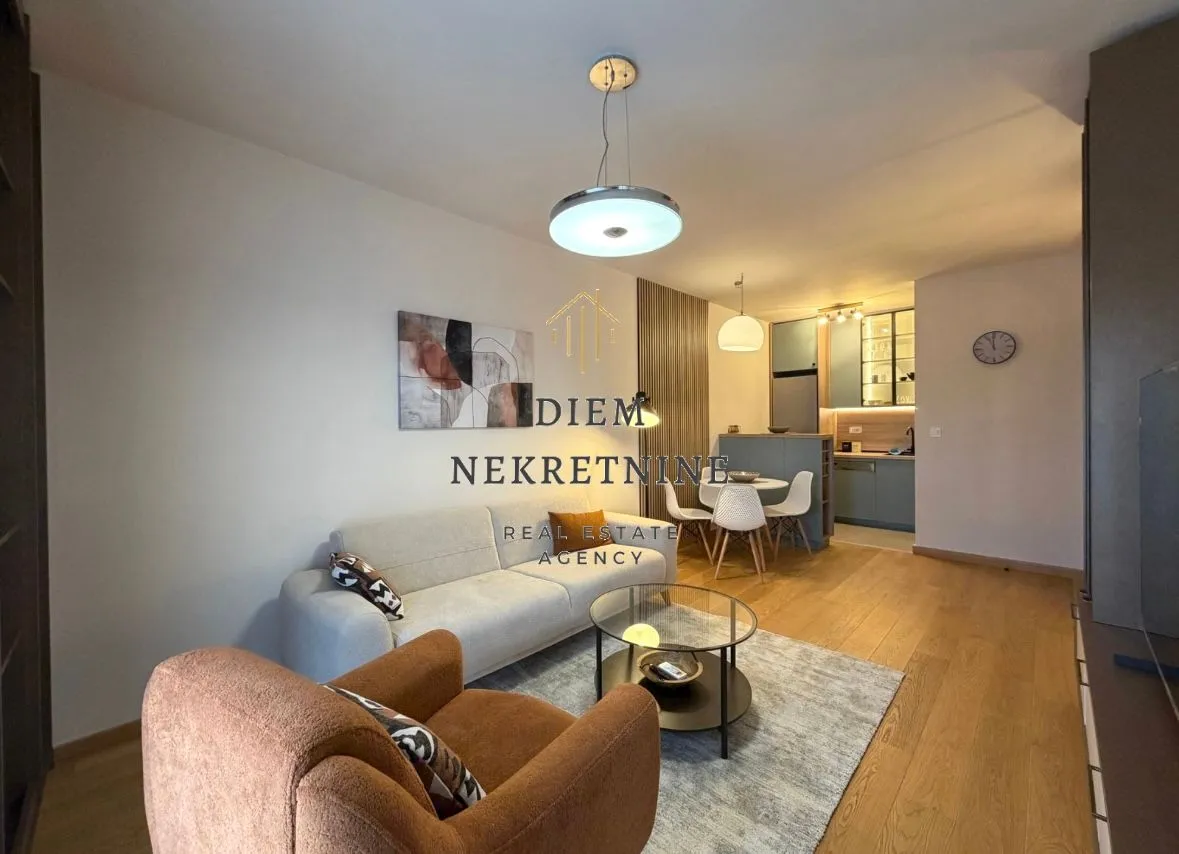Modern living room with a sofa set and dining area.