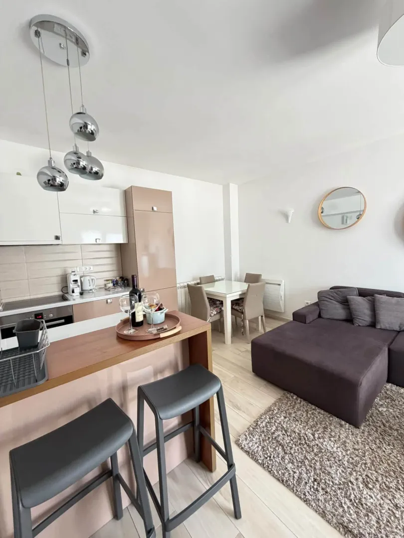 Modern open-plan living room with kitchen and dining area.