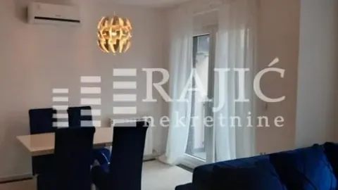 Living room with a dining table and sofa set. - image 3