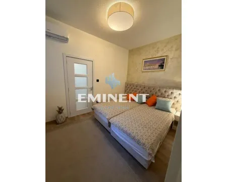 Furnished bedroom with a double bed and air conditioning. - image 8