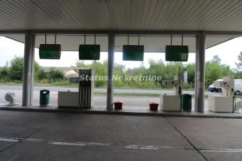 View of the gas station with a canopy and fuel dispensers. - image 14