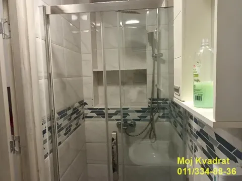 View of the shower cabin in a tiled bathroom. - image 7