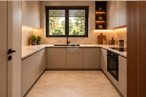Modern U-shaped kitchen with built-in appliances and a window. - image 9