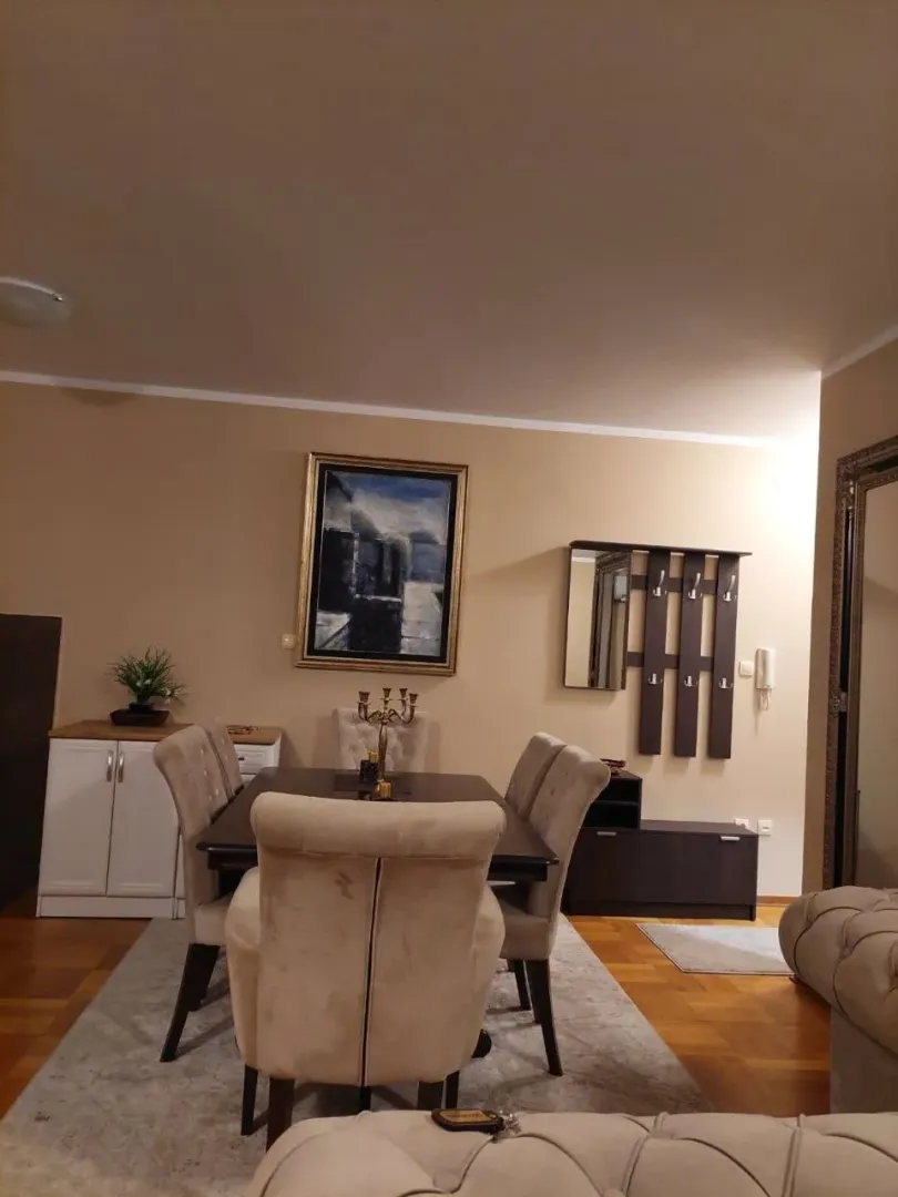 Living room with a dining table and chairs.