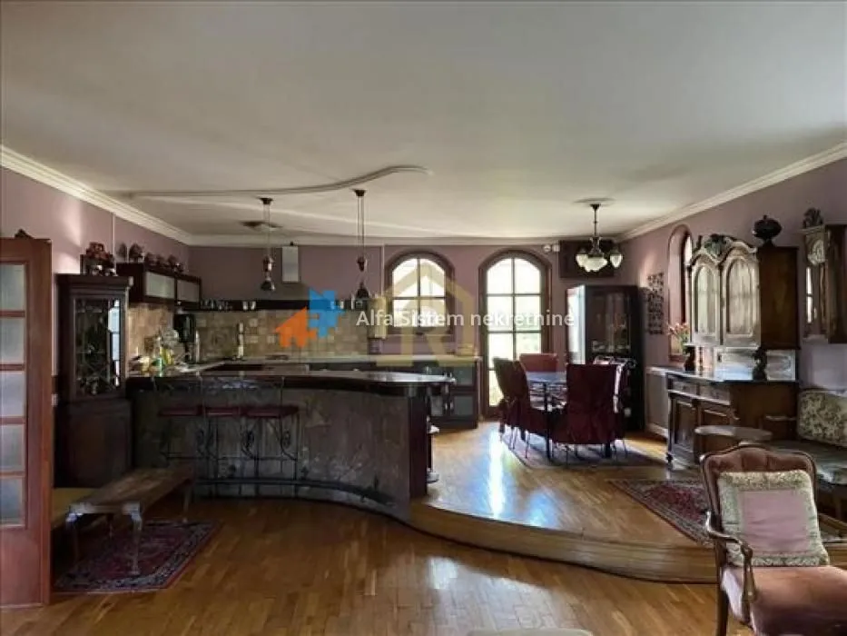 Spacious kitchen with a dining area and rustic furniture.