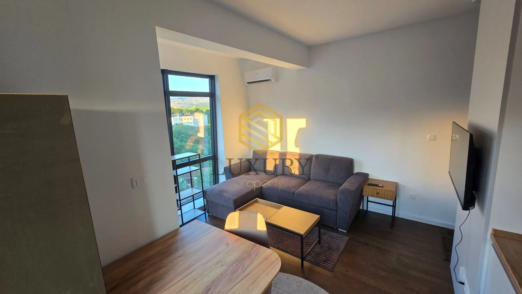 Living room with a sofa and dining table.