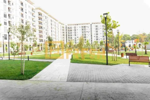 View of the landscaped courtyard area in front of residential buildings. - image 3