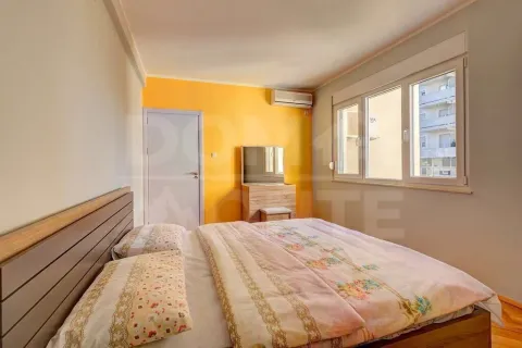Furnished bedroom with a double bed, dresser, and window. - image 7