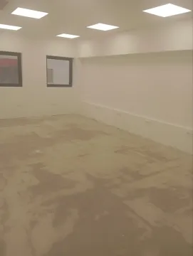 Empty, unfinished room with ceiling lights. - image 8