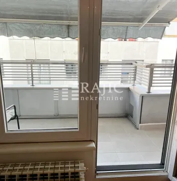 View of a covered terrace with balcony doors. - image 5