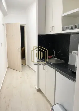 Small kitchen with a sink and built-in units in the hallway - image 6