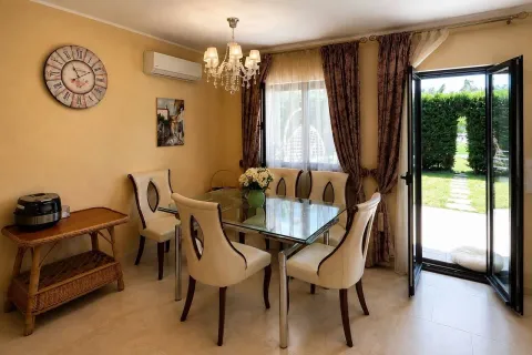 Dining room with a glass table and access to the yard. - image 5