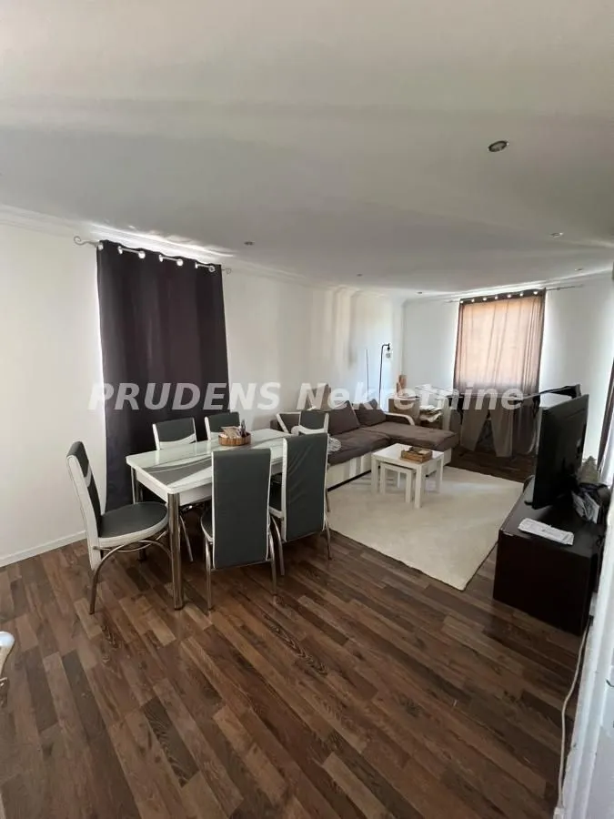 Living room with a dining area and seating furniture.