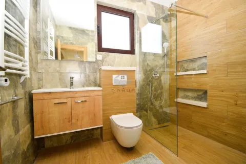 Modern bathroom with a walk-in shower, washbasin, and wall-hung toilet. - image 17