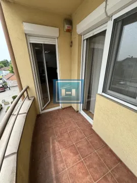 Small tiled balcony with balcony doors and a window. - image 26