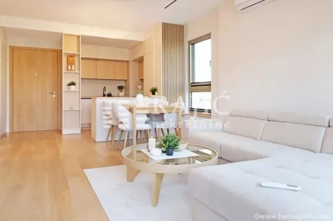 Living room connected to the dining area and kitchen. - image 4