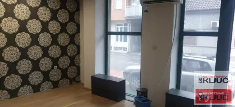 Empty room with large windows and decorative wallpaper on the wall. - image 2
