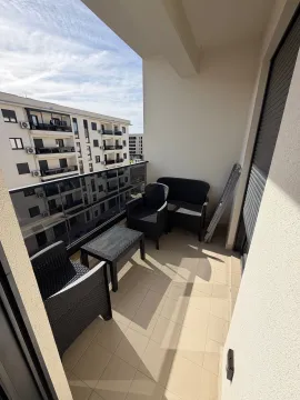 Furnished terrace with seating furniture and a view of the neighborhood. - image 2