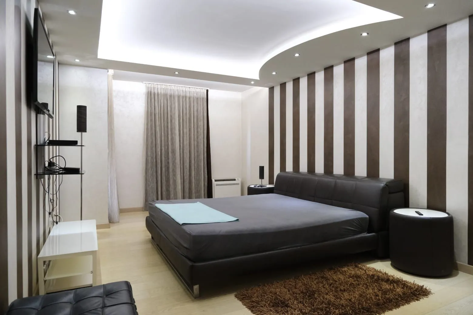 Modern bedroom with a large bed.