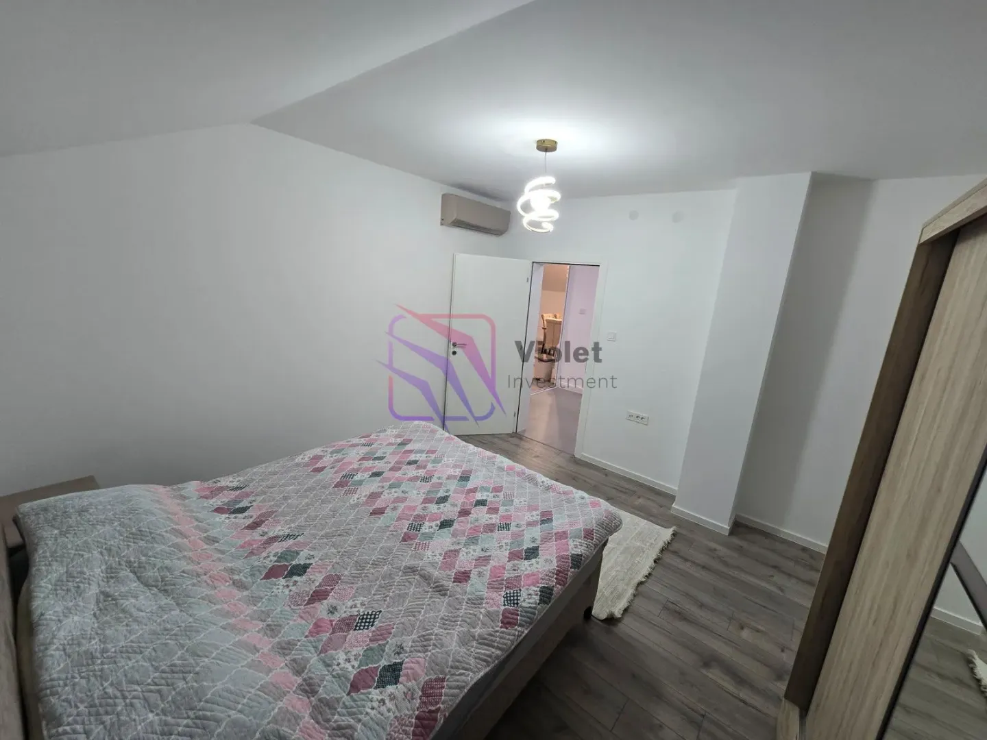 Bedroom with a double bed and wardrobe.