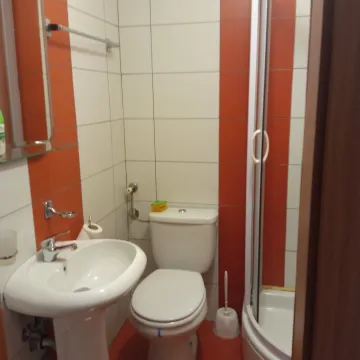 Small bathroom with a shower. - image 9