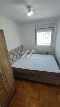 Bedroom with a double bed, wardrobe, and a window. - image 5