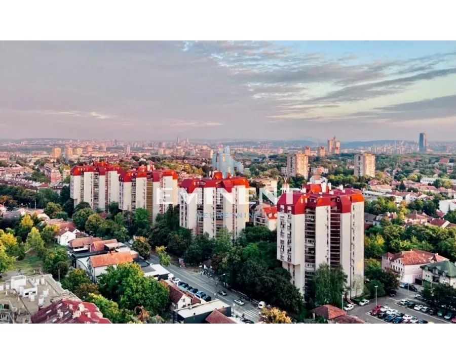 View from the window overlooking the city panorama and surrounding buildings.