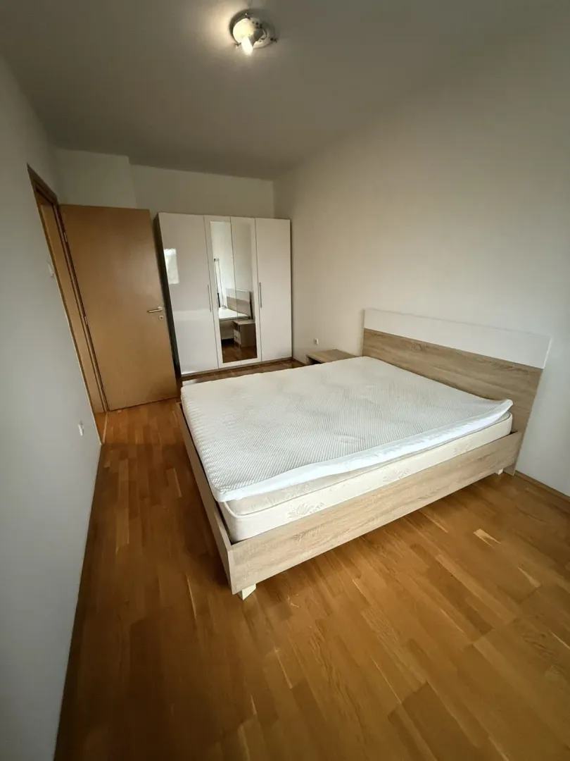 Bedroom with a double bed and a wardrobe.