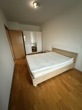 Bedroom with a double bed and a wardrobe. - image 3