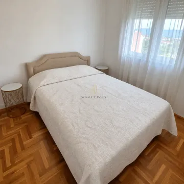 Bedroom with a double bed, nightstands, and parquet flooring. - image 7