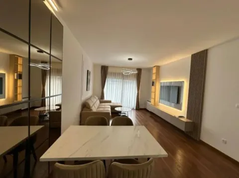 Living room with a dining area and modern furniture. - image 10