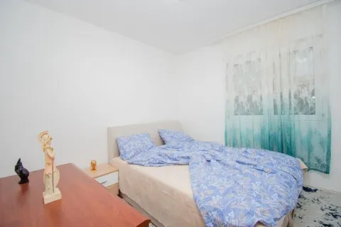 Bright bedroom with a double bed and a window. - image 10