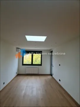 Empty room with parquet flooring and a window. - image 4
