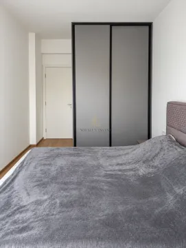 Furnished bedroom with a double bed and built-in wardrobe. - image 7