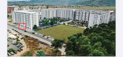 Aerial view of the residential complex with landscaped courtyard and parking. - image 2