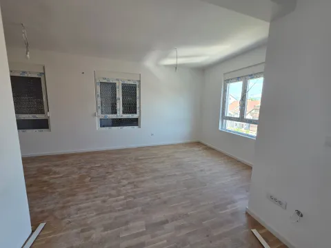 Empty bright room with parquet flooring and white walls. - image 12