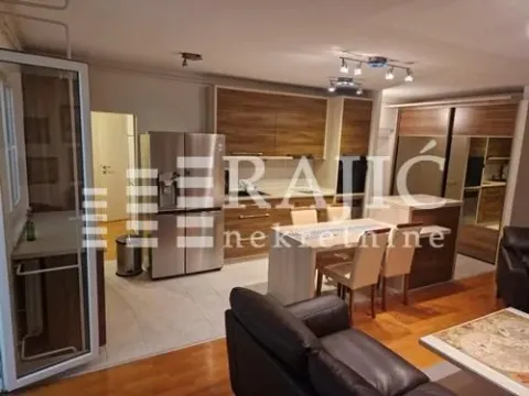 Modern kitchen with dining area and living room in an open space. - image 4