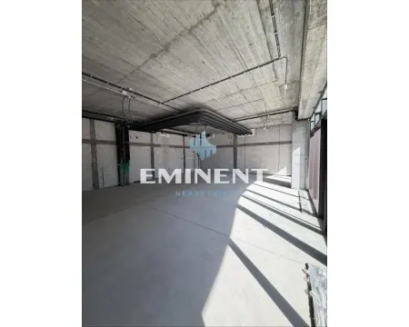 Unfurnished commercial space or retail unit under rough construction with a concrete ceiling. - image 5
