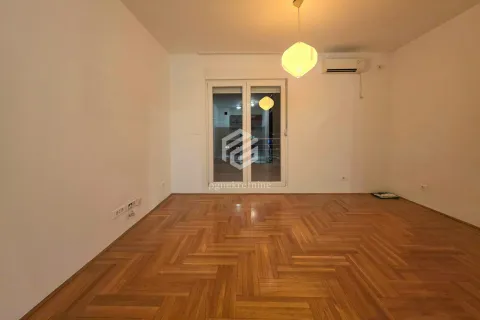 Empty room with hardwood parquet flooring and access to the terrace. - image 9