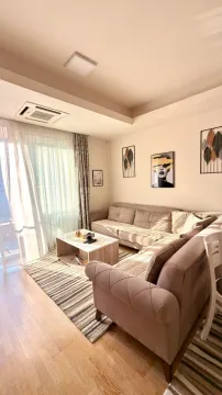 Bright living room with a sectional sofa and access to the terrace. - image 2