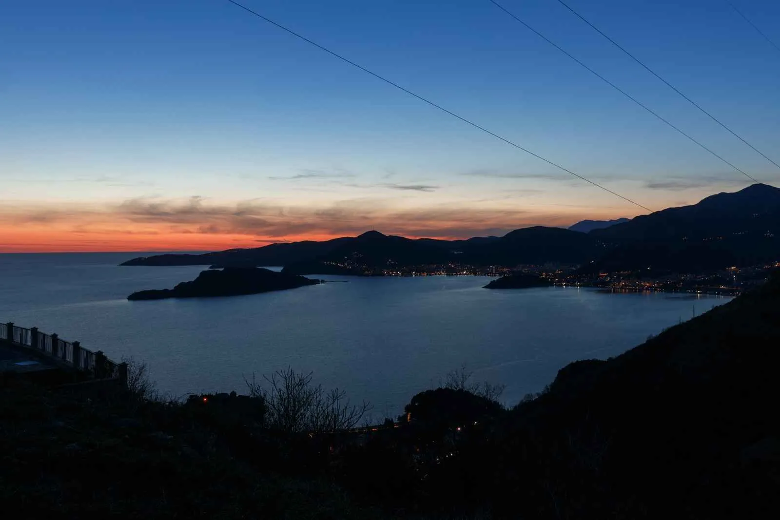 View of the bay and city at dusk from the terrace.