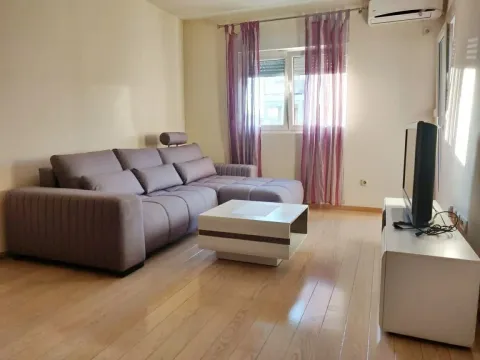 A bright living room featuring a corner sofa and a coffee table. - image 2