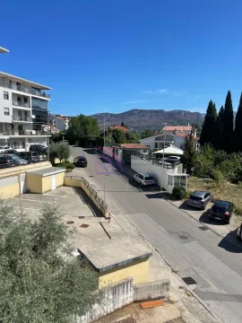 View from the terrace towards the street and surrounding buildings. - image 15