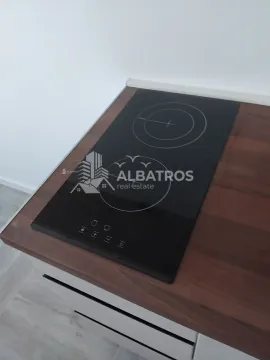 Built-in glass-ceramic cooktop on the kitchen countertop. - image 4