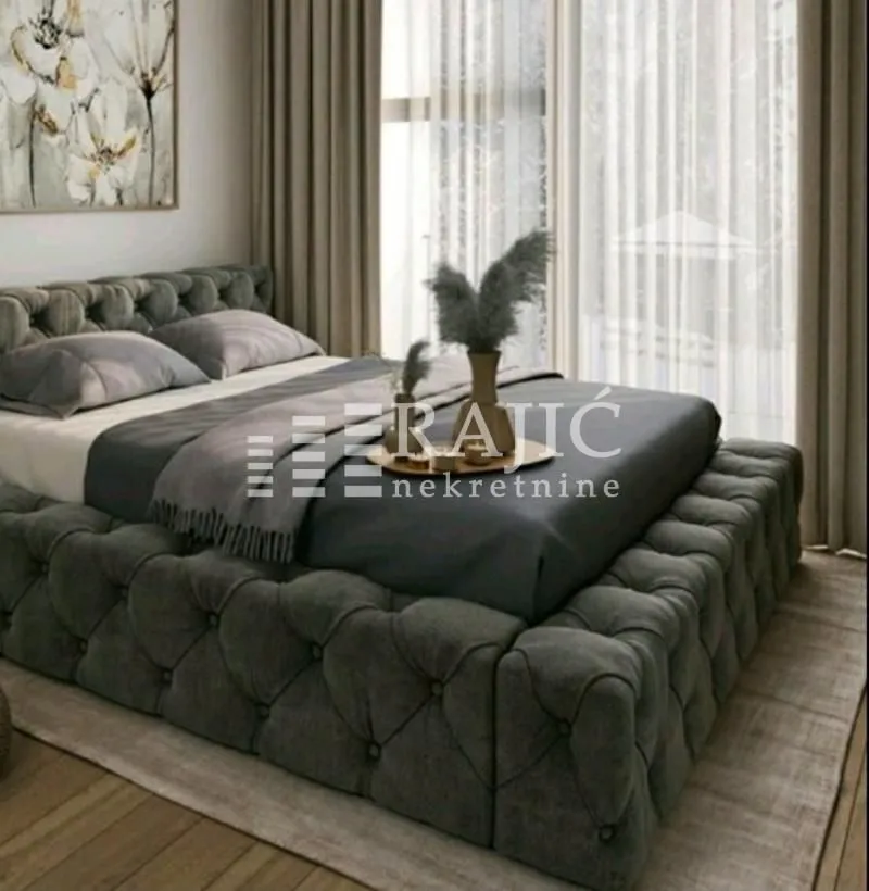 Modern bedroom with a large double bed.