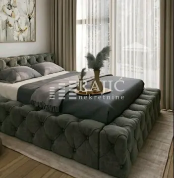 Modern bedroom with a large double bed. - image 11