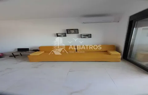 Living room with a yellow sofa and an air conditioner on the wall. - image 5