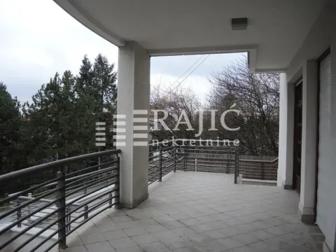 Spacious tiled terrace with a metal railing and a view of nature. - image 16
