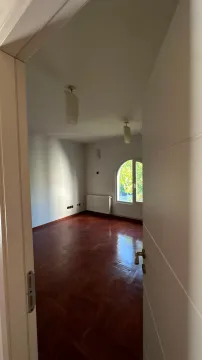 View of an empty room with parquet flooring through an open door. - image 15