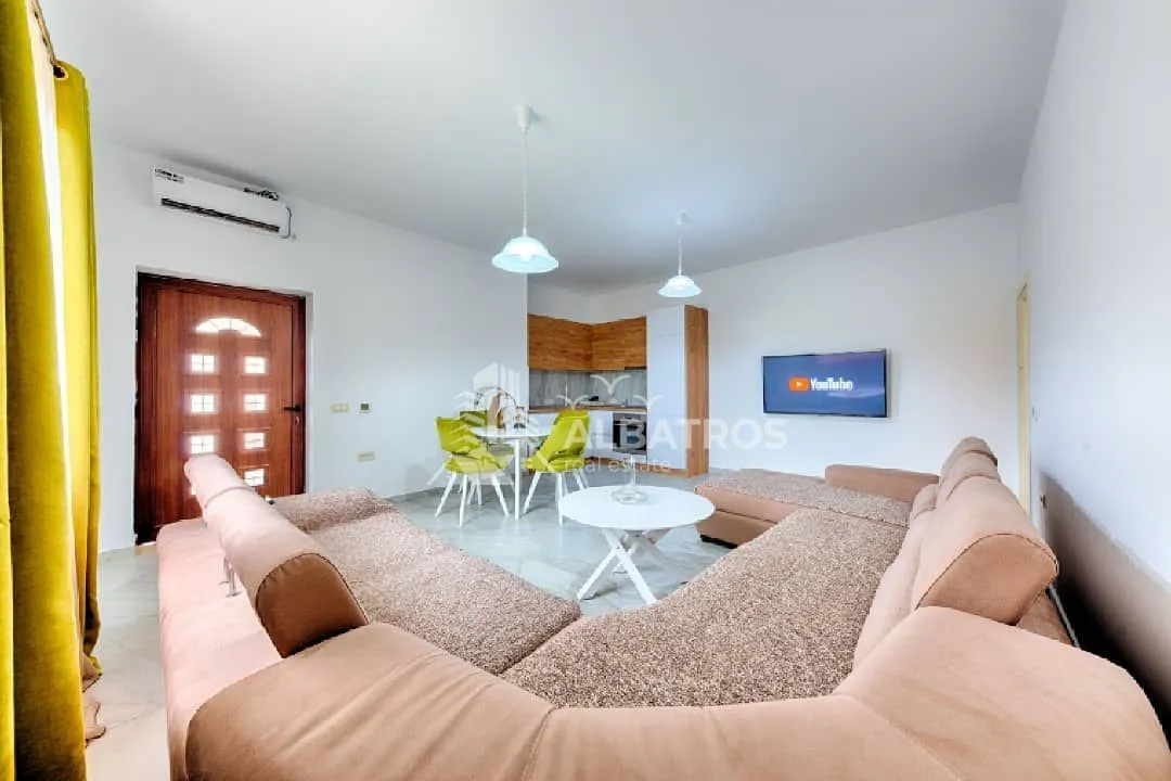 Spacious living room connected to the dining area and kitchen.
